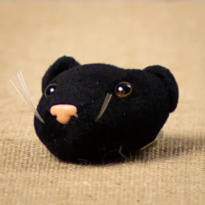 Add panther pride to your DIY homecoming mums and garters! This 3" Panther Head plush - 1 piece is perfect for school spirit, keychains, and crafts.