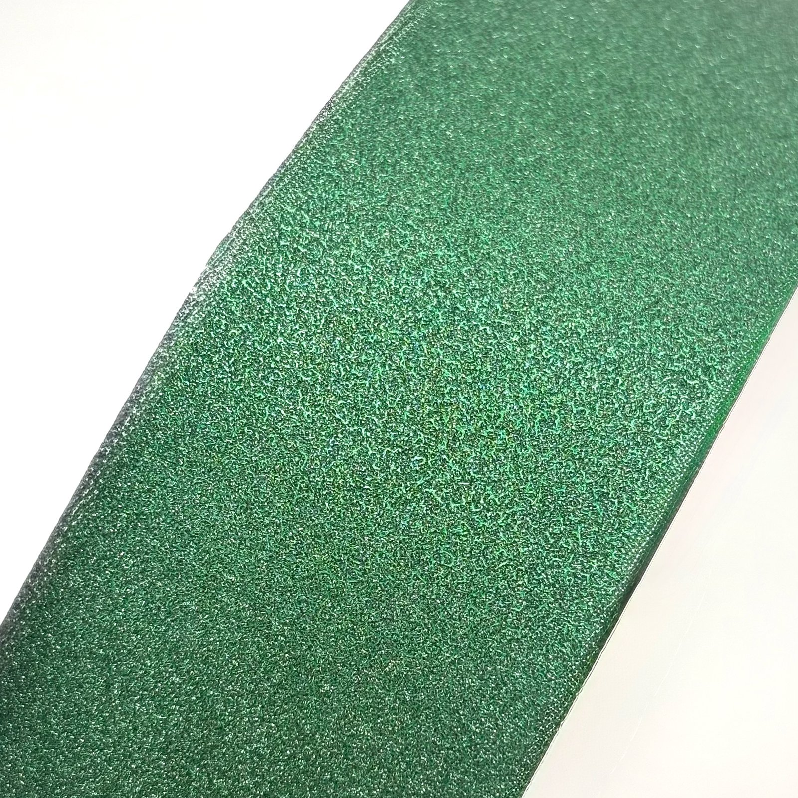 Emerald diamond dust ribbon on a #16 - 2 inch by 100 yard roll at wholesale pricing for homecoming mums.